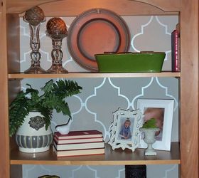 share some love with your blah bookshelves don t let this valentine s go by with, home decor, shelving ideas, Here are the shelves put back into the unit Because I have two shelving units with a large piece containing the TV inside I really want symmetry I was recently told that books are not for bookshelves what Yes there are books placed on the shelf but I took the covers off and used the pages to show instead of the spines Also you can see that I have turned to the pages side of the books so the coloration was uniform Starting from the sides I used larger items working towards the middle While adding color I placed my pieces in odd numbers I have 12 ceilings in my living room so I definitely needed height on top Stepping back several times I took my time at styling I tried several different pieces and tweaked it until it felt right