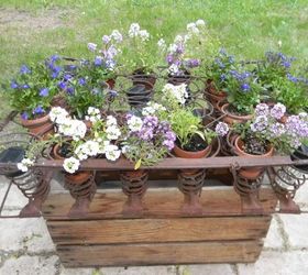 an apple box rusted out mattress springs solar lights cuteness, container gardening, flowers, gardening, repurposing upcycling, Side view during the day