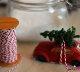 vintage red car driving home with the tree, christmas decorations, crafts