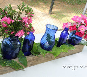 centerpiece with blue glass bottles, crafts, home decor, repurposing upcycling