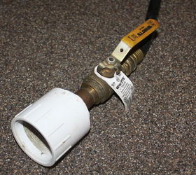 creating a simple and inexpensive rain water collection system, curb appeal, go green, We connect a standard garden hose to the tanks with a simple threaded adapter