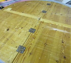round table upcycled to a wall clock, repurposing upcycling, woodworking projects, I turned the hinge hardware that folded the table and used them to secure the two sides straight On the front I used wood finish and putty to smooth out the space When it was dry I sanded it with sand paper by hand
