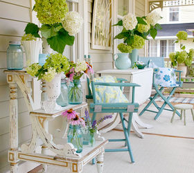 12 inspirational patios amp porches, flowers, gardening, outdoor furniture, outdoor living, patio, porches, Very welcoming cottage porch with mason jars and vintage vases filled with flowers