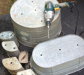 unexpected beauties galvanized tubs and a pool pump turned planter, flowers, gardening, repurposing upcycling, Drill holes in the bottom for drainage and one for rebar