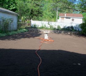 transforming my backyard into a secret garden, flowers, gardening, landscape, outdoor living, perennial, Finally done applying all of the soil 10 yards worth Placed birdbath in center this wil be one focal point in my dream garden Watered the soil
