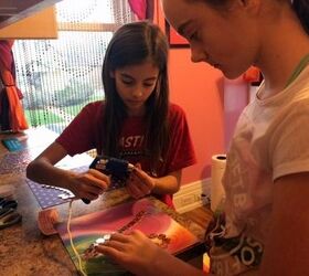 penny keepsake, crafts, repurposing upcycling, Teagan and Taylee hot gluing on the pennies