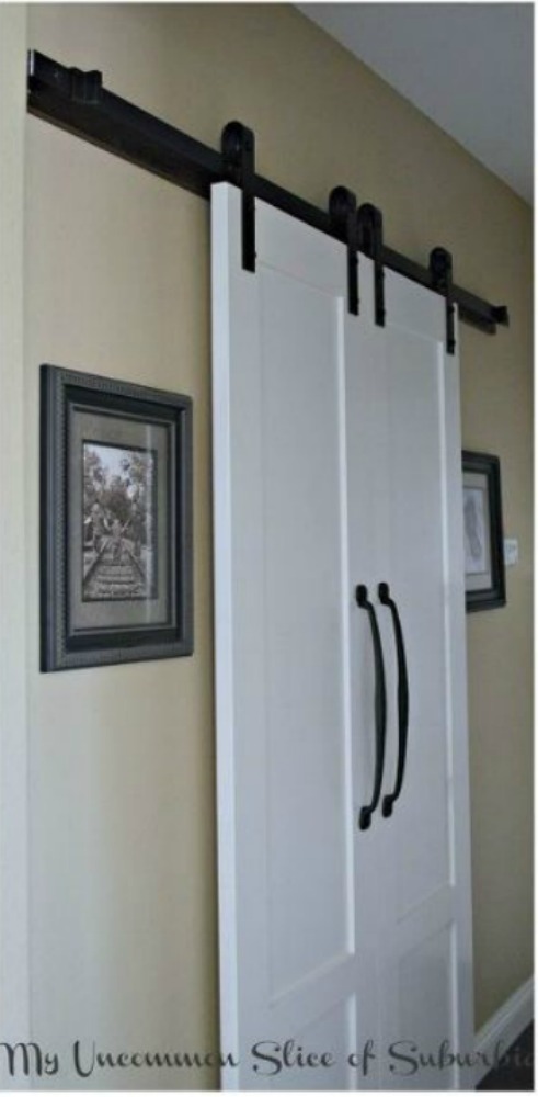 s 11 ways to update your dark and dingy laundry room for under 100, laundry rooms, Dress up your entryway with a barndoor