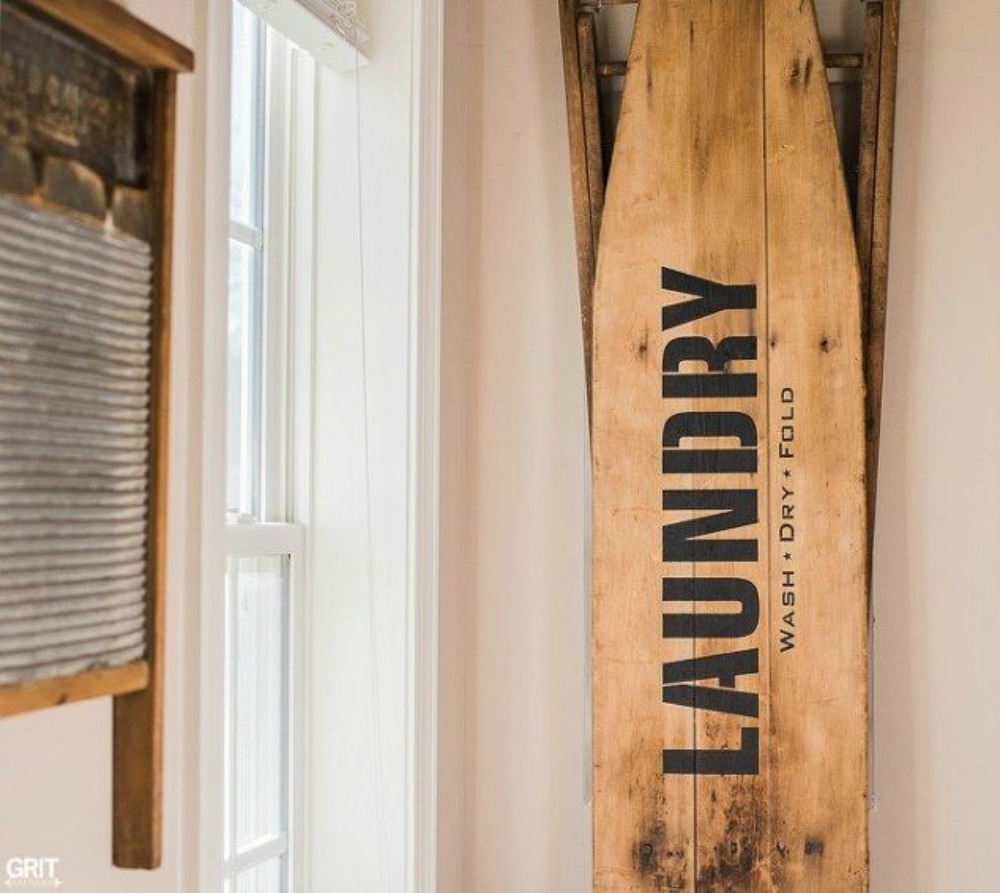 s 11 ways to update your dark and dingy laundry room for under 100, laundry rooms, Add a cute barnwood sign