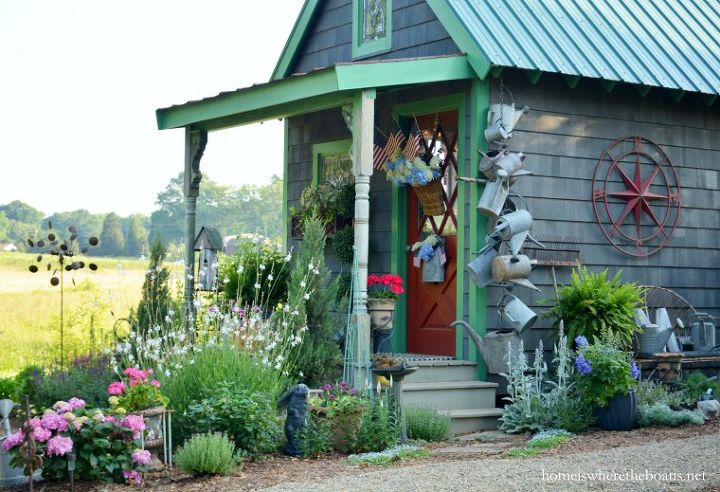 Garden Sheds Madison Wi hang a collection of watering cans to decorate a garden shed Garden Sheds Madison Wi hang a collection of watering cans to decorate a garden shed