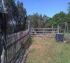 my first spring garden rennovating the landscape, flowers, gardening, pallet, This fence was removed A section now back of pallet compost bin another section turned sideways and reused Black bin in bacground is up against barbed wire fence where all raised beds are situated