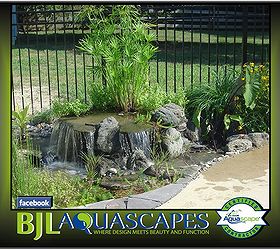 pondless waterfalls disappearing waterfalls waterfall ideas in new jersey bjl, landscape, outdoor living, ponds water features, Small pondless waterfalls can be added just about anywhere in your landscapes This water feature is squeezed in between a patio and fence for a great effect night or day