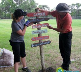 re scape backyard getaway community project, gardening, Making sure the sign is straight