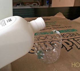 how to cut a glass bottle in half with yarn and fire, crafts, Pouring out some nail polish remover so the yarn could be dunked in