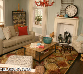 this living room was a fun design challenge in a commercial photography studio, home decor, living room ideas, We used the Shaw rug as inspiration And pulled the pops of red and blue from it to give the room a collected feel