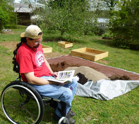 building our first sfg square foot garden, diy, flowers, gardening, how to, raised garden beds, woodworking projects, Reading what the book says to do and trying to figure out how we can combine this mix of soil ingredients We were not able to do what the book suggested so Steve took a shovel and I took a metal rake and we mixed it all together