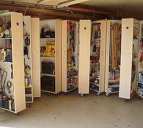 i finally got tired of having all my tools scattered all over my garage and decided, diy, how to, shelving ideas, storage ideas, cabinets open Hard to tell on these photos but cabinet opens to reveal 3 storage areas Each outside door is pegboard on top and shelves at the bottom Center unit is walled up half way with places to hang on each side and above center divider is shelving