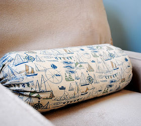 the nautical nursery that changed our lives, bedroom ideas, home decor, Pillows such as this sailboat bolster add to the look without going overboard wink