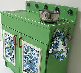 before amp after the makeover of a wooden play kitchen, chalk paint, diy, how to, painted furniture, I lined the doors with vintage fabric from a thrift store table cloth and used cup hooks to hold thrift store measuring spoons