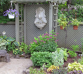 privacy screen ideas and how to make a fence taller, fences, outdoor living, This arbour and lattice combination was actually used to conceal the compost work area and separate the back wooded area from the garden