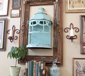 adding aqua, home decor, painted furniture, Full shot of the aqua birdcage and painted side table This is my gallery wall put together entirely of yardsale and thriftstore items
