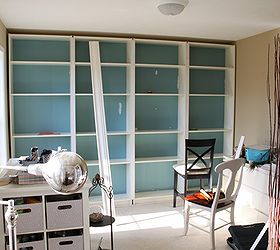 built in bookcases, craft rooms, storage ideas, We slid the four bookcases into place and surrounded it with trim to build it in