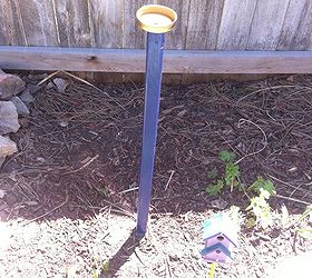 diy garden art, crafts, gardening, I spray painted a leftover wooden stake a dark blue and screwed the cap of the jar lid into the pole