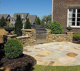 we used river rock which is normally used in creek beds on this outdoor kitchen, outdoor living, patio