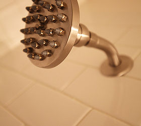 here is a hall bathroom that was in need of help the homeowner called in a panic, bathroom ideas, flooring, home improvement, plumbing, tile flooring, The Danze Parma shower head