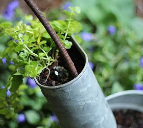 unexpected beauties galvanized tubs and a pool pump turned planter, flowers, gardening, repurposing upcycling, Rebar holds it all together