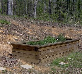creating a raised garden bed in just a few hours, gardening, raised garden beds, Another raised planter bed made by stacking 6x6 s The biggest item with this is getting the base level To secure it together we use timber screws capped it with 2x10 s