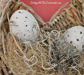 decorating the front porch for easter, easter decorations, seasonal holiday d cor, I placed more of the painted plastic eggs in a basket on the door