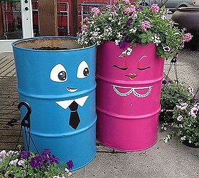 oil drum up cycle, container gardening, gardening, painting, repurposing upcycling, Step 5 Plant each barrel with 3 12 mixed hanging baskets per drum Fill in with soil Add 2 cups of Slow Release Fertilizer and water well