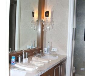 this apartment was designed for clients that used it as their home away from home in, home decor, master bath the existing cabinetry was made a bit more traditional by adding some picture frame filets