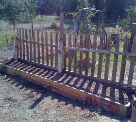my first spring garden rennovating the landscape, flowers, gardening, pallet, Beds under construction This has bulbs and flower seeds Recycled fence see before pictures below