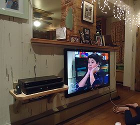 i repurposed shelf brackets from a chair they now hold the shelf that holds the tv, diy, repurposing upcycling, shelving ideas, woodworking projects, custom TV components shelving