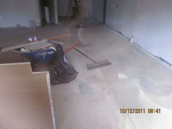 epoxy flooring in a roswell library storeroom prior to baseboard amp racks being, concrete masonry, flooring, painting, wall decor, woodworking projects, what it looked like after carpet was pulled