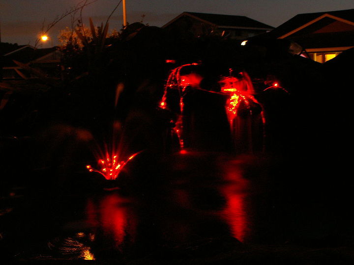 waterscape in the front yard at night enhanced with fiber optic lights that change 8, electrical, gardening, lighting, outdoor living, ponds water features, Koi Pond Waterfall enhanced with Fiber Optic Lighting