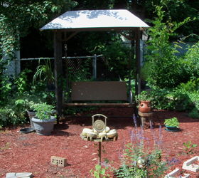 my secret garden in july, flowers, gardening, hibiscus, perennials, raised garden beds, love my swing surrounded by great smelling herbs and grasses