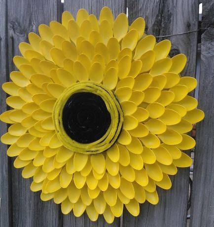 tutorial garden sunflower from plastic spoons, crafts, repurposing upcycling, 100 plastic spoons and some spray paint Cut the handles off y our spoons before you start hot gluing