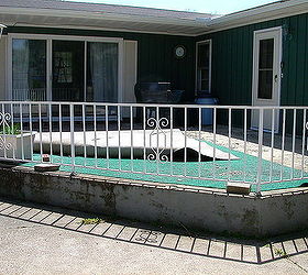 how can i salvage a crumbling cracked 24x24 triangle shaped concrete patio without, railing has to go as well wrought iron just not my style would like stone planter wall around this instead