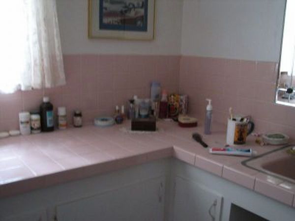 pink is evil according to my husband, bathroom ideas, tiling, Pink tile counter top and partly up the wall