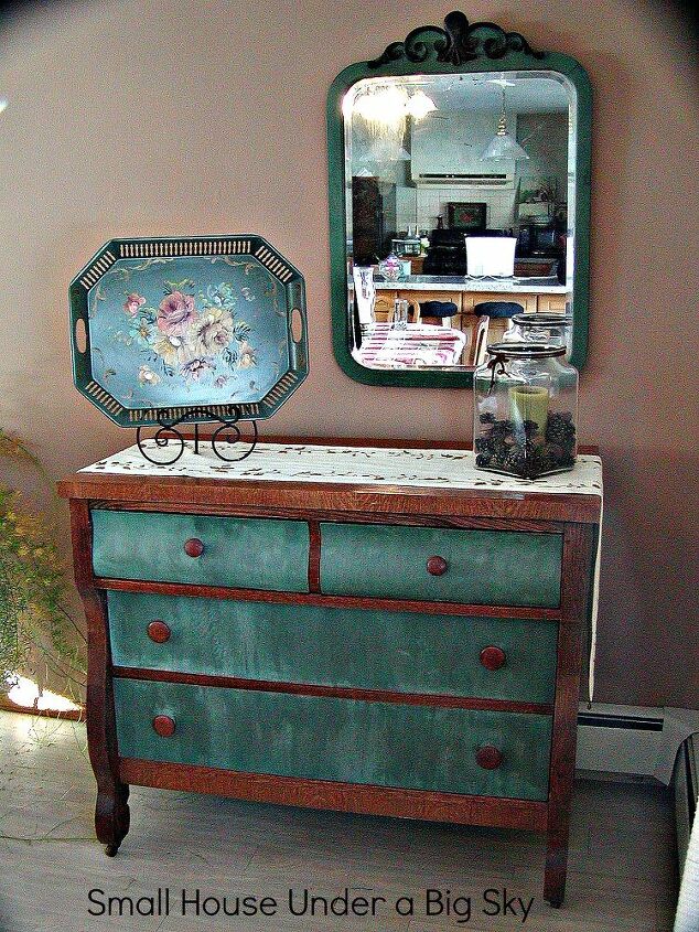 double duty furniture pieces maximize storage, painted furniture, I painted this roomy dresser and moved it into our dining room to use as a sideboard and for extra linen storage