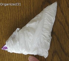 how to fold plastic shopping bags to take up less space, cleaning tips, You end up with a compact and neatly folded triangle football You ll be surprised how much less room your plastic bags will take up when folded this way