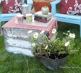 outdoor seating area my summer style, flowers, outdoor living, repurposing upcycling, I used an old coal bucket to plant my yellow petunias and an old wooden box with chippy paint as a coffee table