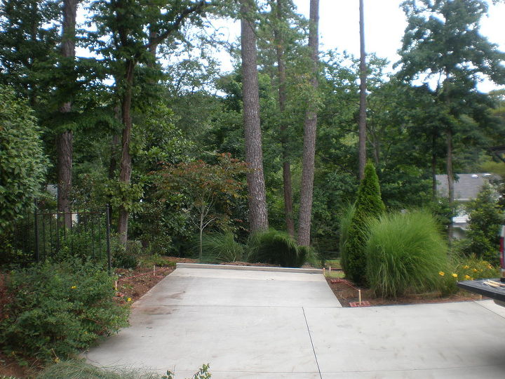 build carport over parking pad and add concrete walkway, Before carport was built