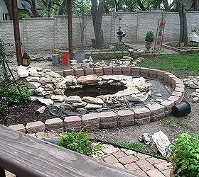 building a backyard pond, outdoor living, ponds water features, Built a stone wall around the pond to keep landscaping and mulch from washing away