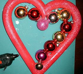 how to make a valentine ornament wreath, crafts, seasonal holiday decor, valentines day ideas, wreaths, How to make a valentine ornament wreath Placing the bulbs with hot glure