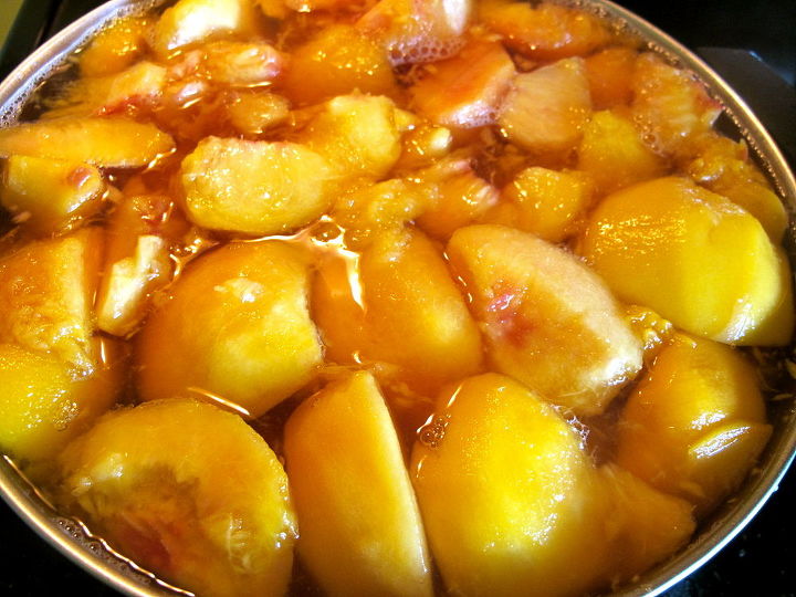 canning peaches, homesteading, Cut remove the pit and simmer in a syrup for about 5 minutes You can use all sorts of syrups from a heavy sugar syrup to a more natural one using juice or even just water