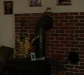 can you hang a flat screen tv over a woodstove, previous owners photo of woodstove setup
