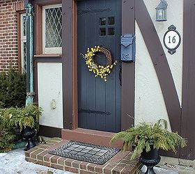 turning dollar store finds into a spring wreath, crafts, seasonal holiday decor, wreaths, Once the soil in the urns thaw more forsythia will be added to give it a unified look